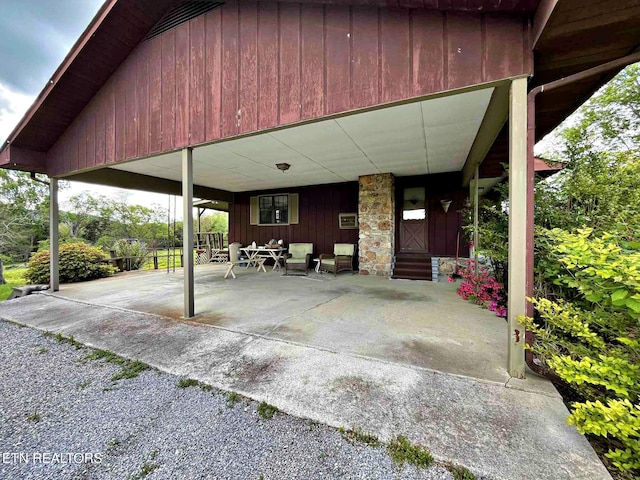 view of patio / terrace featuring a porch and an attached carport