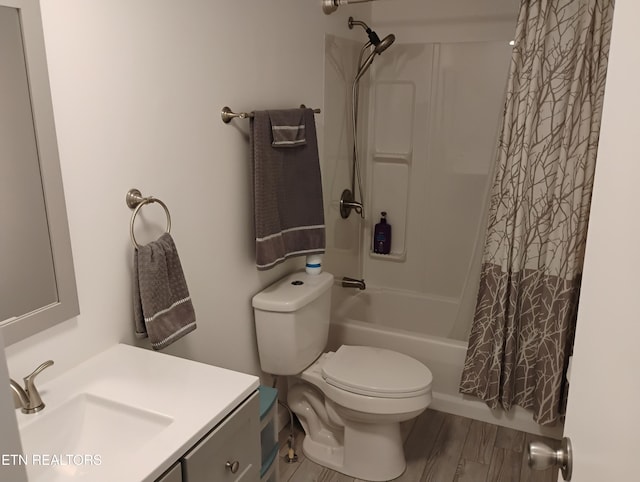 bathroom with vanity, toilet, and shower / tub combo