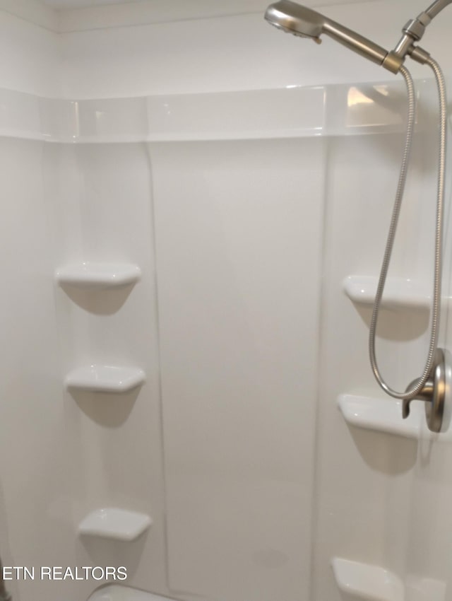 bathroom featuring walk in shower
