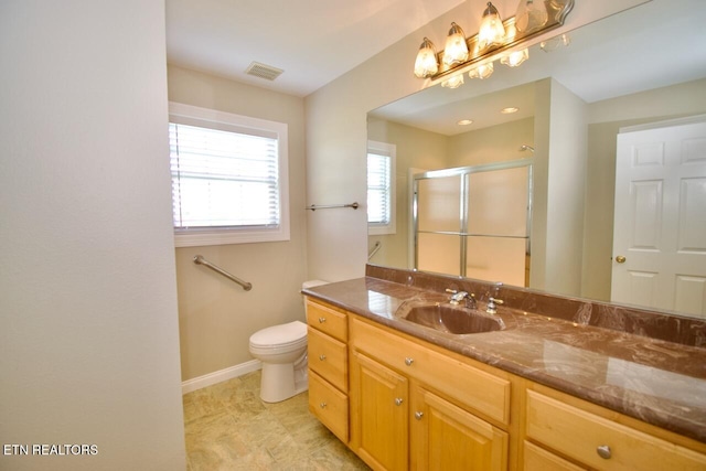 full bath featuring vanity, toilet, baseboards, a shower stall, and visible vents