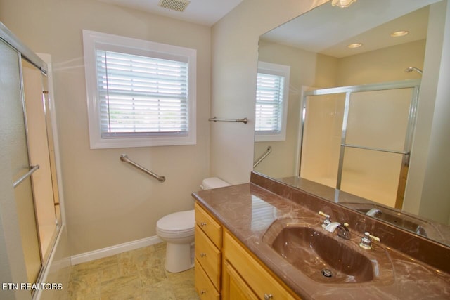 full bath featuring visible vents, vanity, toilet, baseboards, and an enclosed shower