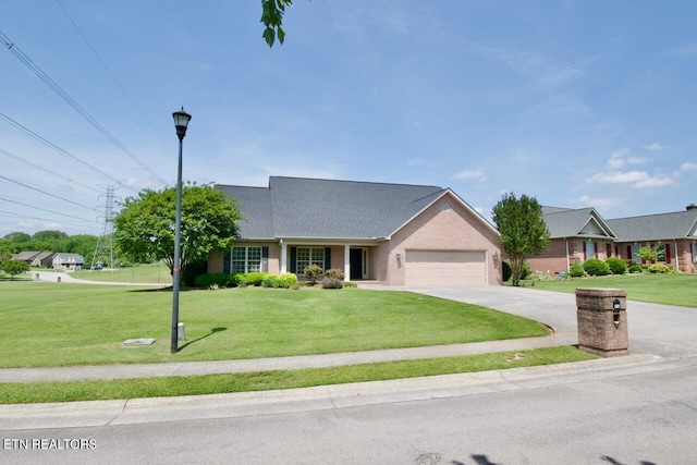 single story home with an attached garage, concrete driveway, and a front lawn