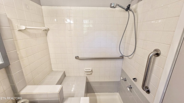 bathroom with a tile shower