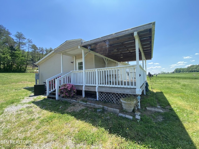 view of home's exterior featuring a lawn and a wooden deck