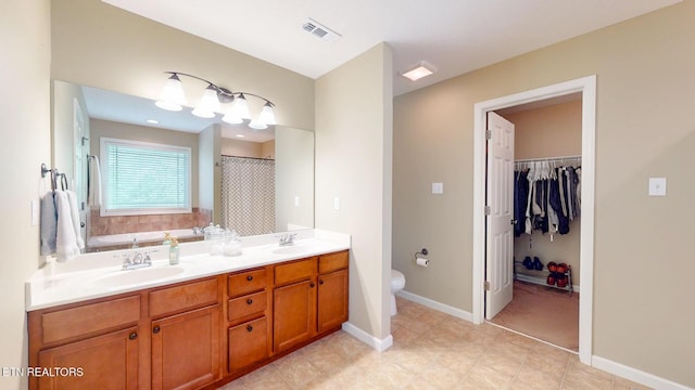 full bath featuring a sink, toilet, double vanity, and visible vents