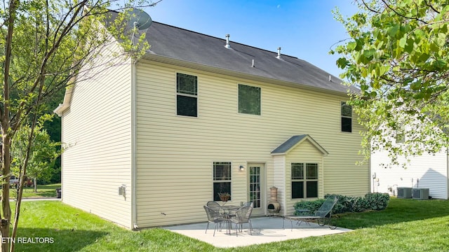 back of house with a patio, a yard, and cooling unit