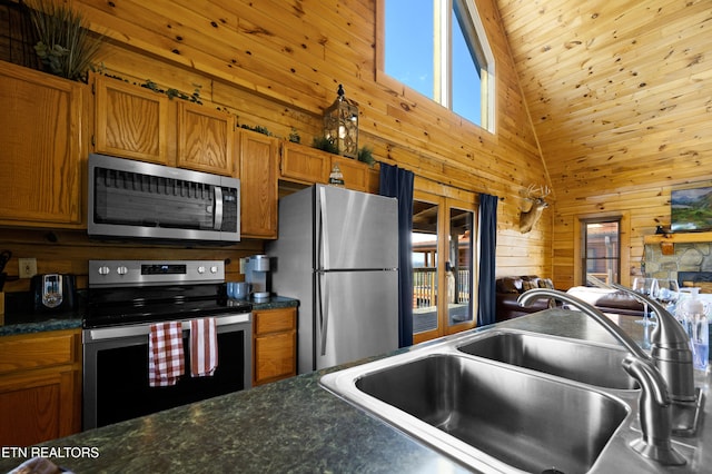 936 Buck Way, Sevierville, TN 37876 - kitchen with a sink, appliances with stainless steel finishes, brown cabinets, and a wealth of natural light
