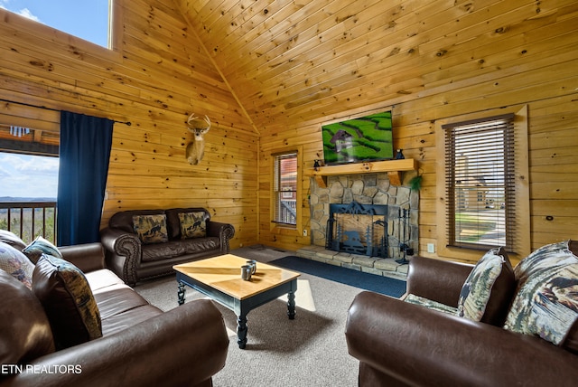 936 Buck Way, Sevierville, TN 37876 - carpeted living room with wooden walls, high vaulted ceiling, and a fireplace