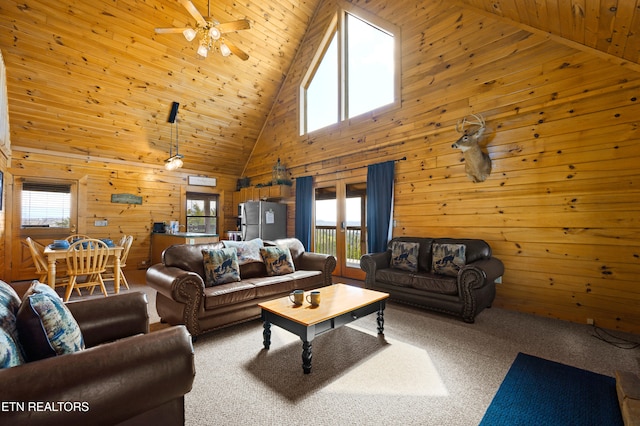 936 Buck Way, Sevierville, TN 37876 - carpeted living area with high vaulted ceiling, wood ceiling, and wood walls