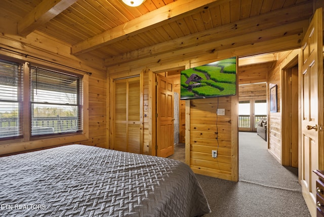 936 Buck Way, Sevierville, TN 37876 - carpeted bedroom with wooden ceiling, beamed ceiling, and wood walls