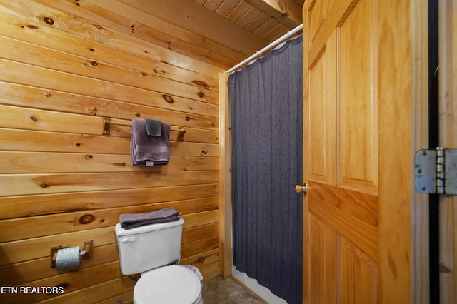 936 Buck Way, Sevierville, TN 37876 - full bath featuring curtained shower, wooden walls, and toilet