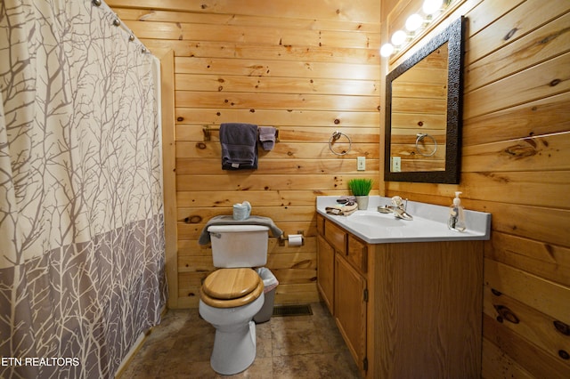 936 Buck Way, Sevierville, TN 37876 - full bath with vanity, wood walls, curtained shower, and toilet