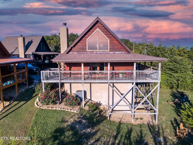 936 Buck Way, Sevierville, TN 37876 - back of house with a lawn, log siding, a chimney, and a wooden deck