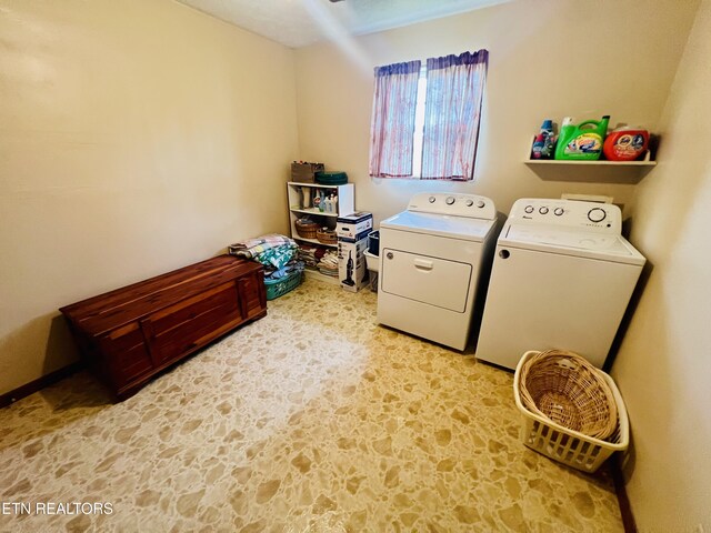 washroom featuring laundry area and washing machine and dryer