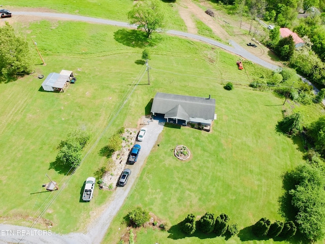 birds eye view of property with a rural view
