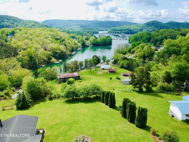 drone / aerial view with a water and mountain view