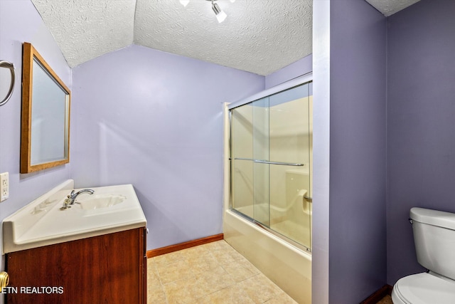 full bathroom with vanity, toilet, a textured ceiling, enclosed tub / shower combo, and baseboards