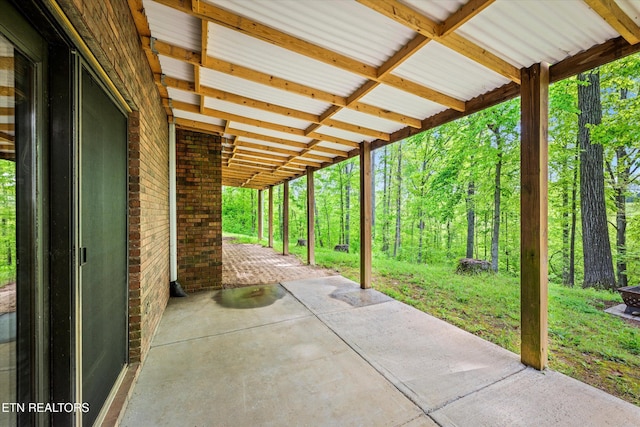 view of patio with a wooded view