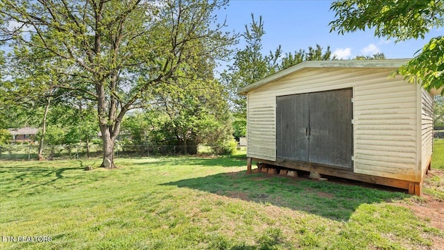 view of shed with fence