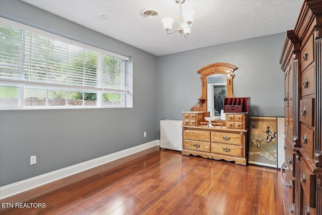 12116 W Kings Gate Rd, Farragut, TN 37934 - bedroom featuring a chandelier, hardwood / wood-style flooring, and baseboards