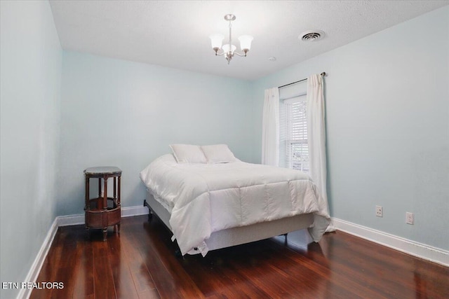 12116 W Kings Gate Rd, Farragut, TN 37934 - bedroom featuring a chandelier, wood finished floors, and baseboards