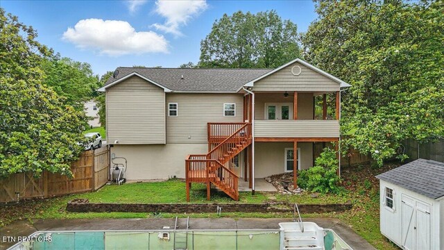 12116 W Kings Gate Rd, Farragut, TN 37934 - rear view of house with stairway, a deck, and an outbuilding
