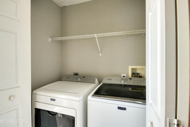 washroom with laundry area and washer and clothes dryer