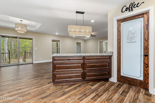 interior space featuring baseboards, recessed lighting, and dark wood-style flooring