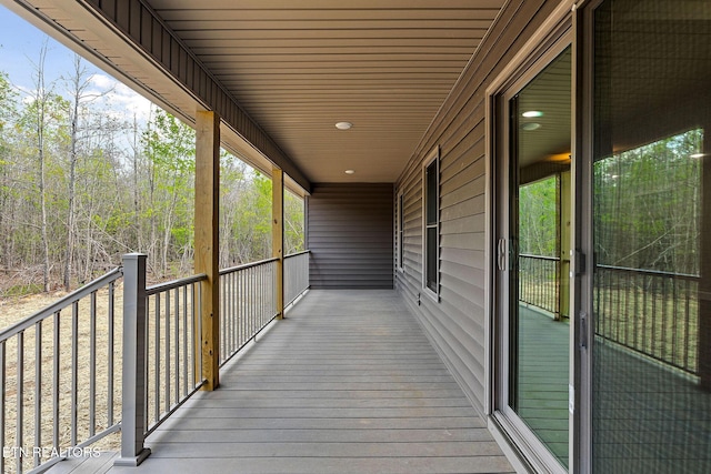 wooden terrace with a porch