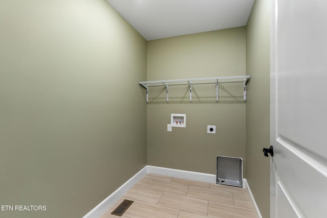 laundry room with washer hookup, hookup for an electric dryer, laundry area, and baseboards