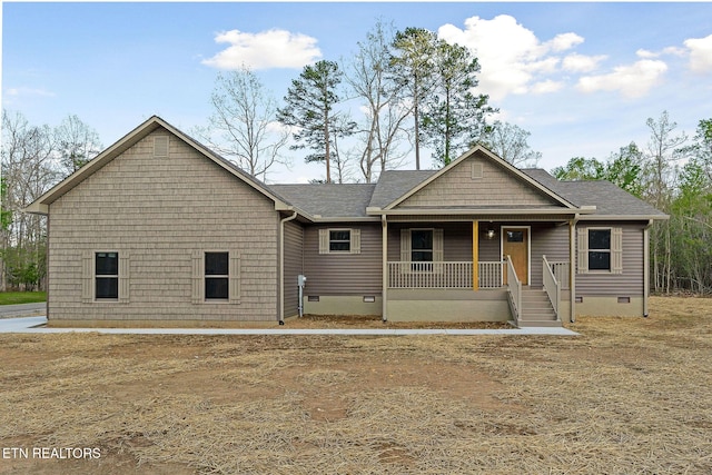 view of front of property with roof with shingles, covered porch, and crawl space