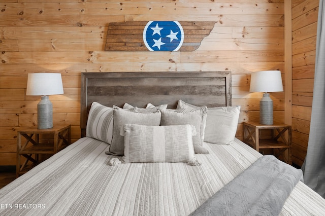 bedroom with wooden walls