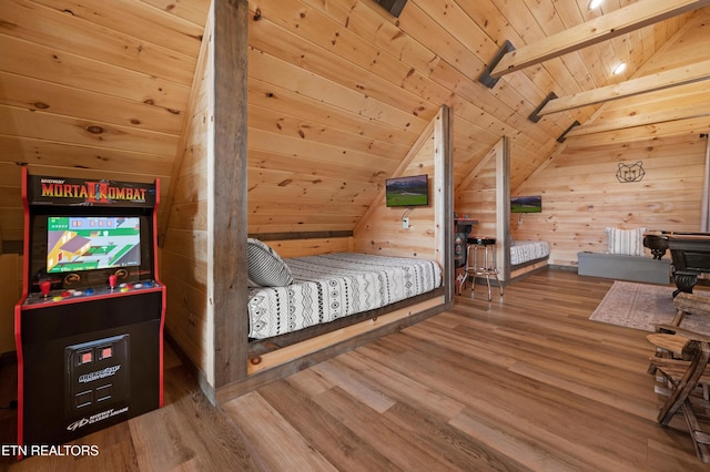 bedroom featuring wood walls, wooden ceiling, vaulted ceiling with beams, and wood finished floors