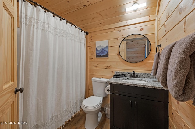 full bath with wood walls, wood finished floors, vanity, wooden ceiling, and toilet
