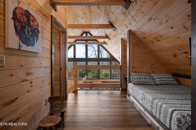 bedroom featuring wooden walls, lofted ceiling with beams, wooden ceiling, and wood finished floors