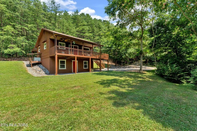 3009 Winding Way, Cosby, TN 37722 - rear view of house featuring a deck, a view of trees, a lawn, and stairway