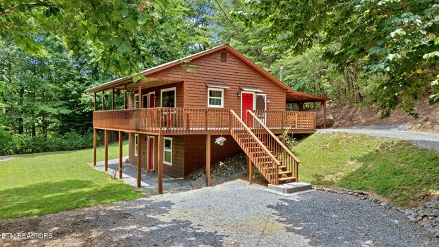 3009 Winding Way, Cosby, TN 37722 - rustic home featuring a front yard, a wooden deck, and stairs