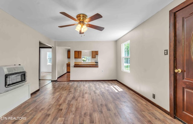 1526 W View St, Athens, TN 37303 - unfurnished living room with baseboards, heating unit, ceiling fan, and wood finished floors