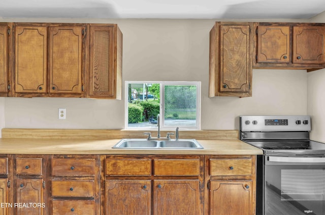 1526 W View St, Athens, TN 37303 - kitchen featuring light countertops, a sink, brown cabinets, and stainless steel electric range oven