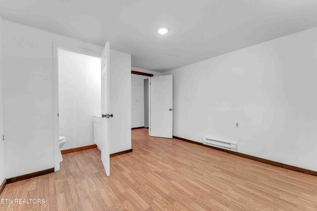 1526 W View St, Athens, TN 37303 - unfurnished bedroom with light wood-type flooring, baseboards, and baseboard heating
