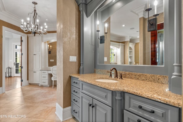bathroom with vanity, ornamental molding, tile patterned flooring, and a wealth of natural light