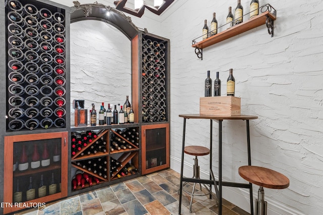 wine cellar featuring stone finish flooring