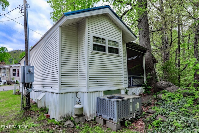 5355 E Pkwy, Cosby, TN 37722 - view of side of home with central AC unit and a sunroom