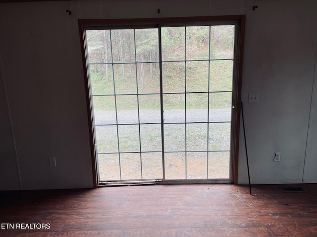 entryway with wood finished floors