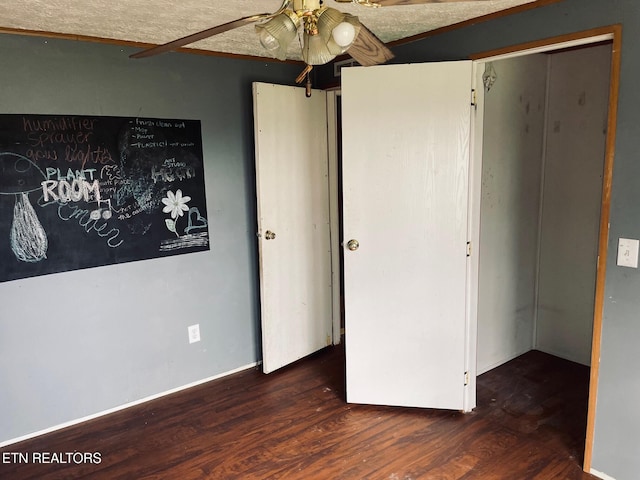 unfurnished bedroom featuring ceiling fan and wood finished floors