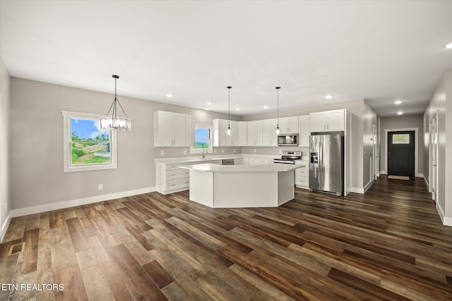 448 Taylor Rd, Byrdstown, TN 38549 - kitchen with dark wood finished floors, a center island, stainless steel appliances, recessed lighting, and visible vents