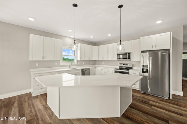 448 Taylor Rd, Byrdstown, TN 38549 - kitchen featuring a sink, light countertops, stainless steel appliances, white cabinetry, and a kitchen island