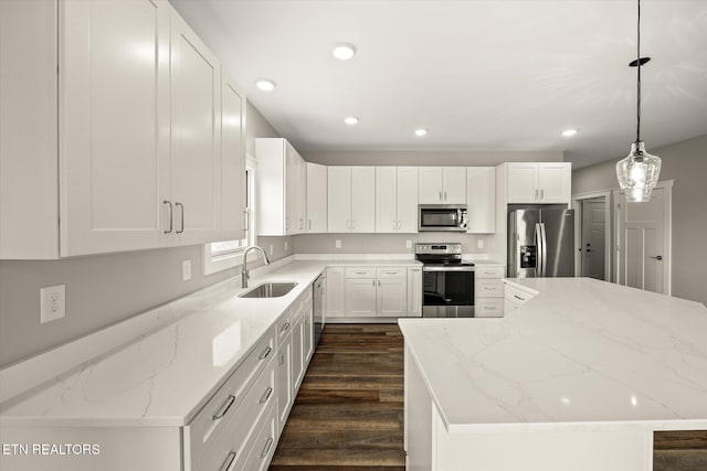 448 Taylor Rd, Byrdstown, TN 38549 - kitchen with a kitchen island, a sink, stainless steel appliances, white cabinetry, and dark wood-type flooring