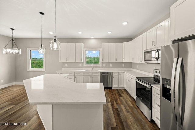 448 Taylor Rd, Byrdstown, TN 38549 - kitchen featuring stainless steel appliances, dark wood-style floors, a sink, and a center island