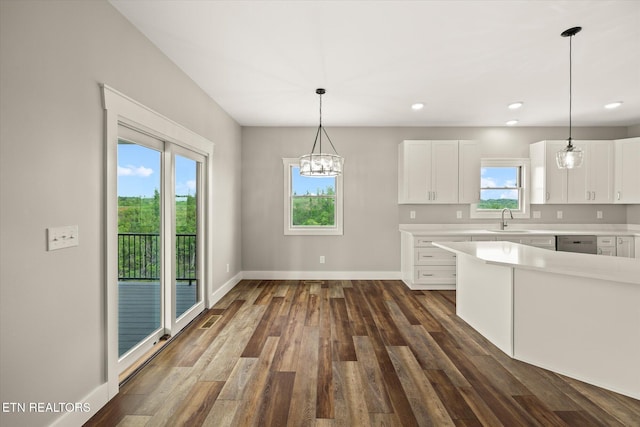 448 Taylor Rd, Byrdstown, TN 38549 - kitchen with dark wood-style flooring, a sink, light countertops, white cabinetry, and stainless steel dishwasher